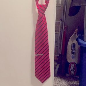 Pink with black stripes tie .